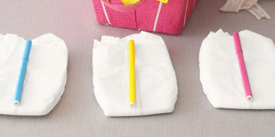 Nappies and pens on a table for the 