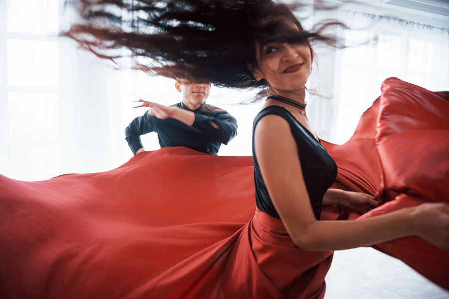A woman dancing in a dance workshop, a fun and energetic hen party idea for a hen do with Photobox.
