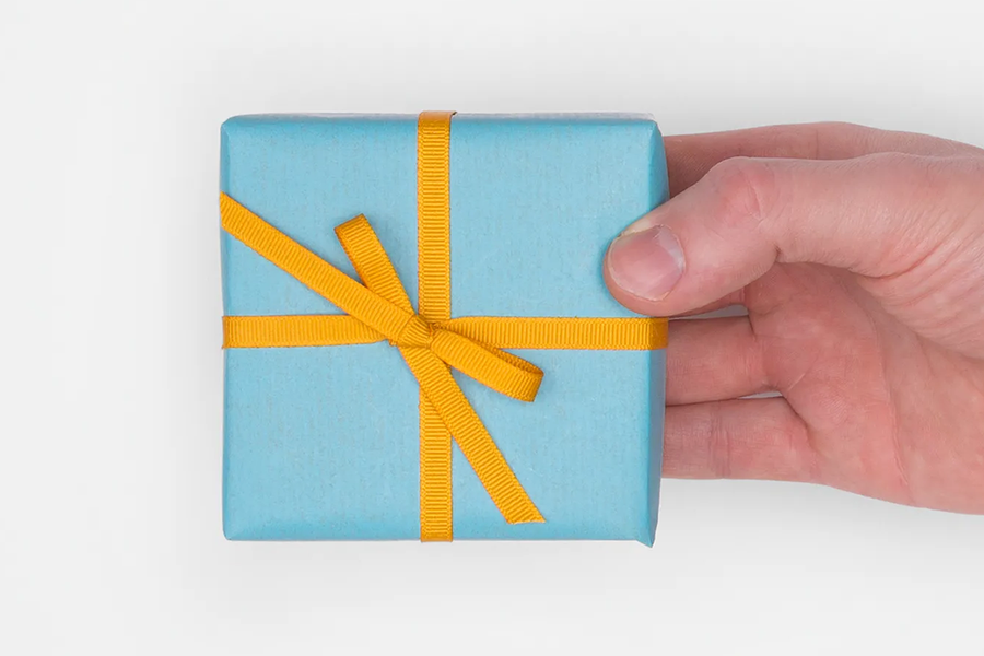 Photobox gift card in a small wrapped gift box; a versatile mother’s day gift idea for 2026.