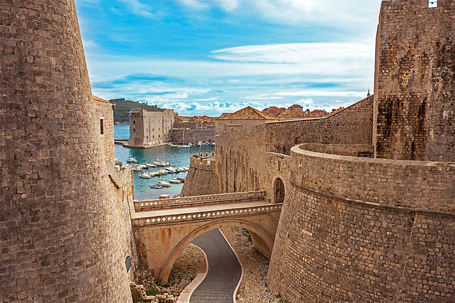 A stunning view of the historic Old Town and city walls of Dubrovnik, a perfect setting for a romantic getaway.