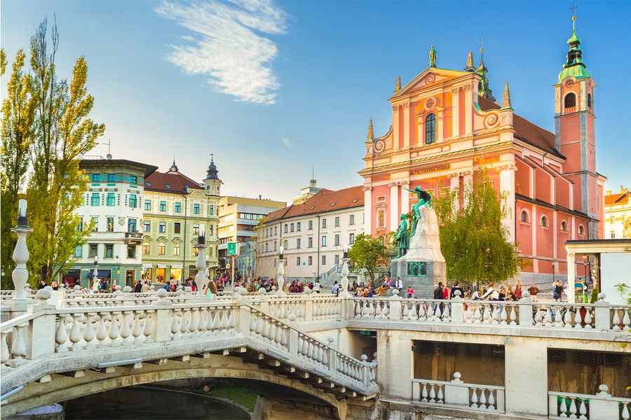 Capturing the romance of Ljubljana with a scenic view of its bridges, a hidden gem for a couples' getaway.
