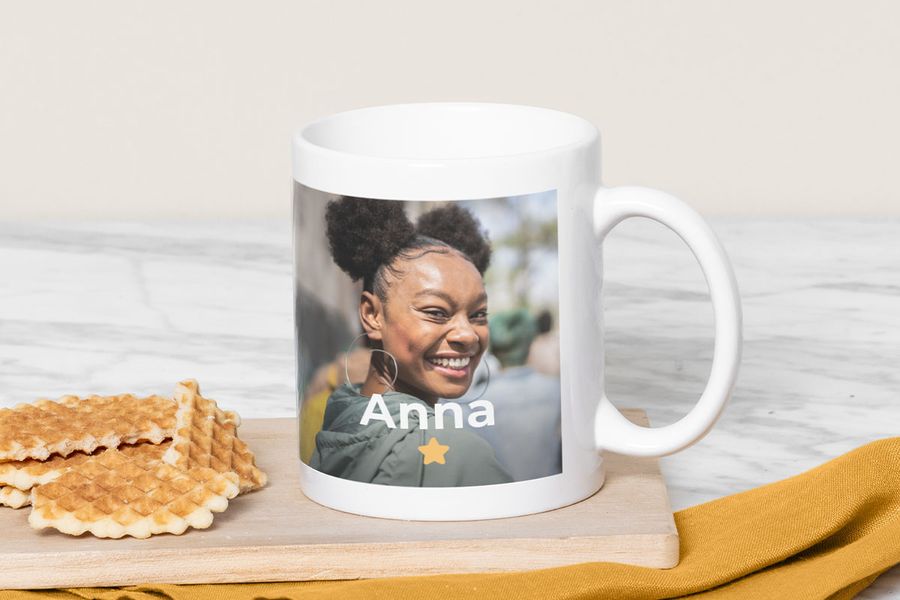 A personalised Photobox mug showing a smiling young woman, inspiring graduation gift ideas and personalised mug gifts.