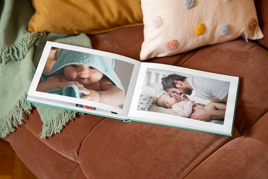 Personalised Photobox photo book for Father's Day featuring a baby and father embracing.
