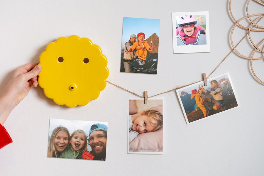 High-quality Photobox family photo prints displayed on a string as a gift for dad.
