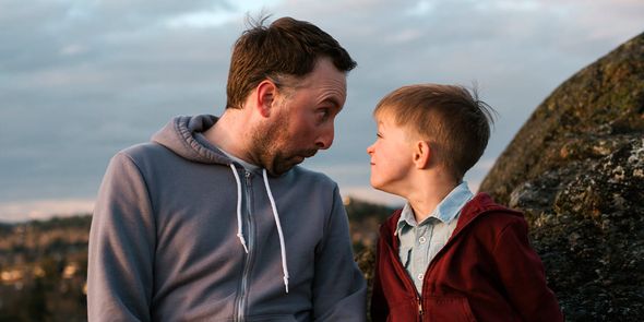 Father and son making silly faces. A fun Photobox father's day gift idea for a playful dad.