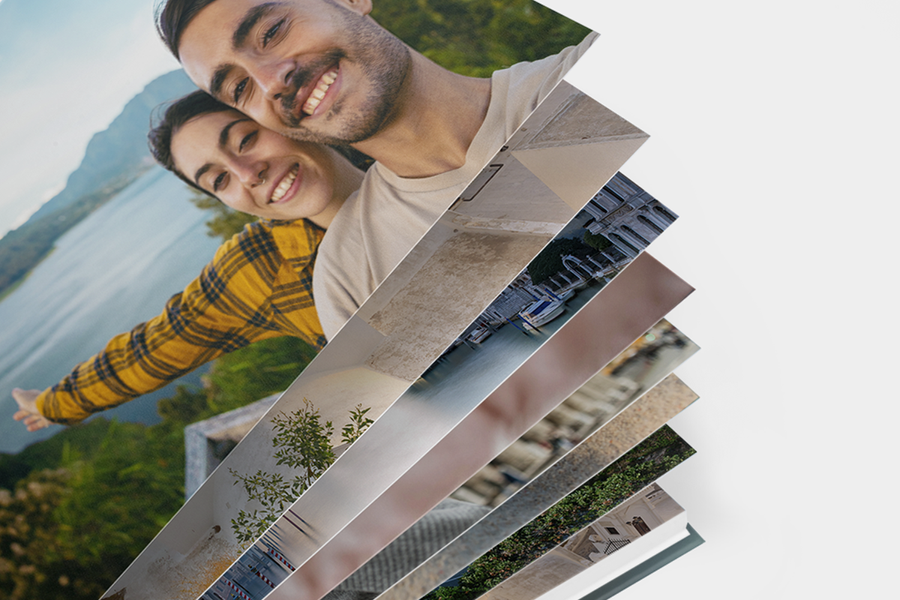 A premium layflat photo book from Photobox with pages fanned out to show there is plenty of space for every snap in your photo album or photo book.