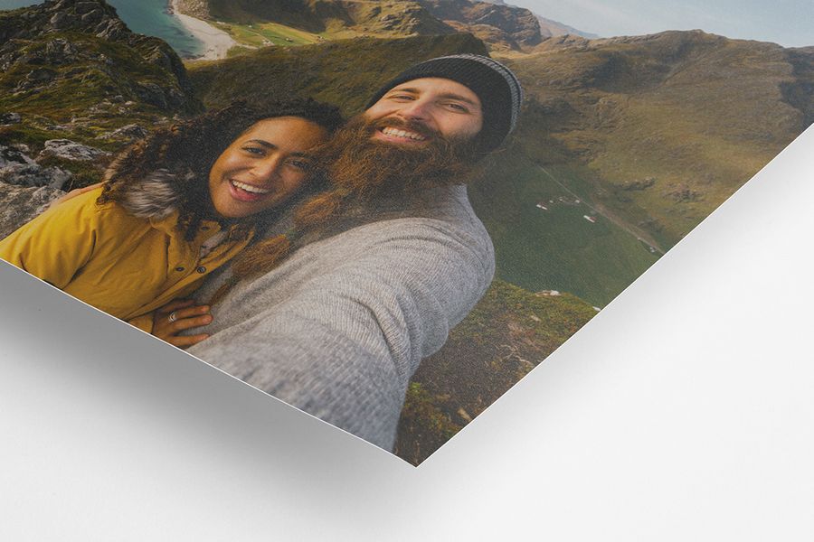 A matt photo print of a smiling couple, showing the difference between matt and glossy.