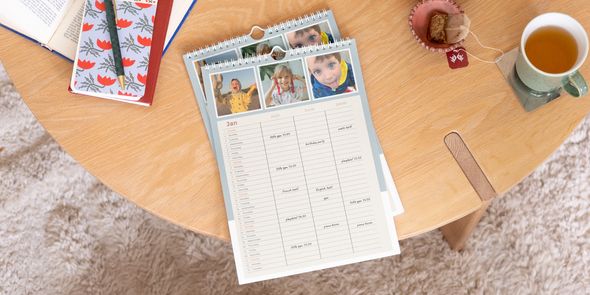 Personalised Photobox family planner displayed prominently on a wooden coffee table