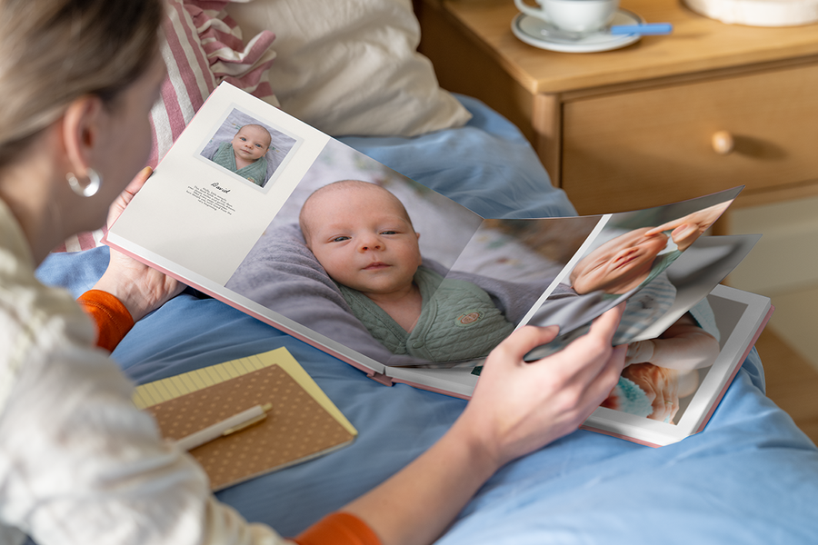 An open my first photo book from Photobox with text displaying how to add personalised details.