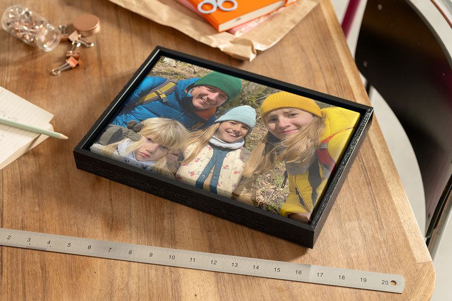 Personalised wall art of a family photo on a mounted print, ideal for small wall spaces.