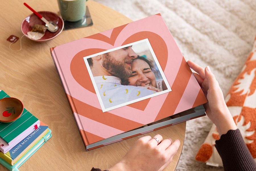 A personalised photo book for a couple featuring an embracing pair, providing inspiration for beautiful phrases for photo albums and romantic photobook quotes.