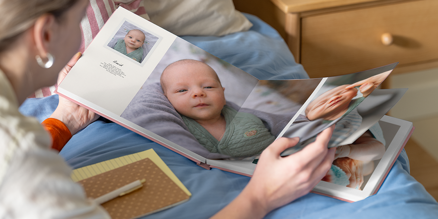 An open my first photo book from Photobox with text displaying how to add personalised details.