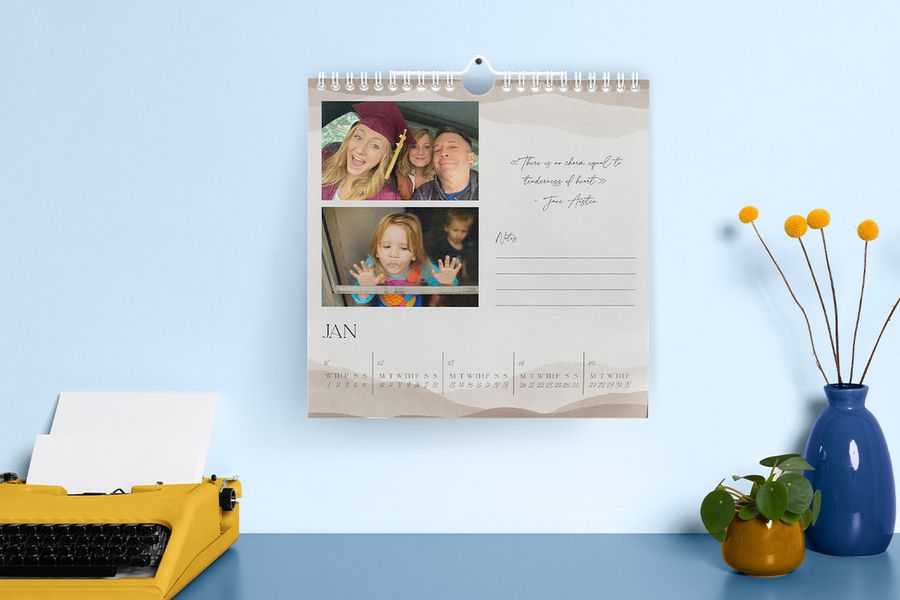 A personalised Photobox wall calendar showing a graduation photo alongside a childhood picture, inspiring graduation gift ideas and personalised photo calendar gifts.