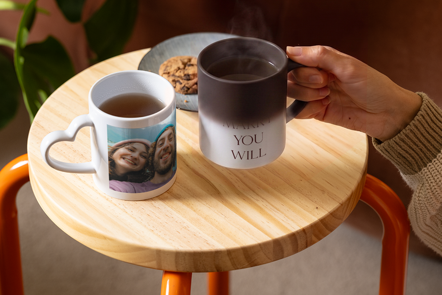 A personalised Photobox heat-changing mug slowly reveals the words “Will you marry me”, showing a creative and romantic proposal idea.