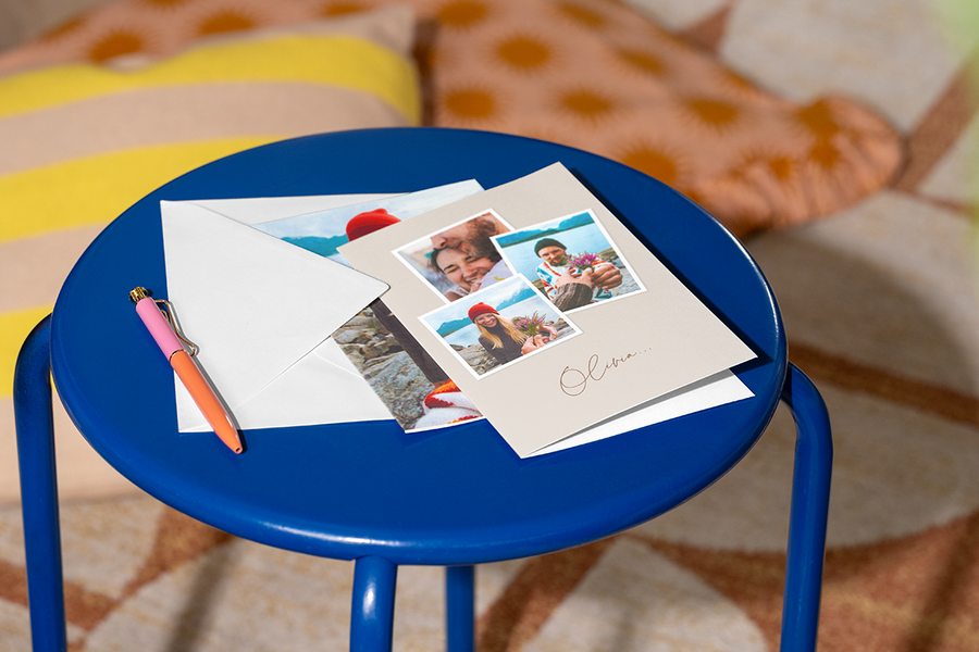 A personalised Photobox card showing different photos of a happy couple, illustrating how a custom card can be a lovely and meaningful way to propose.