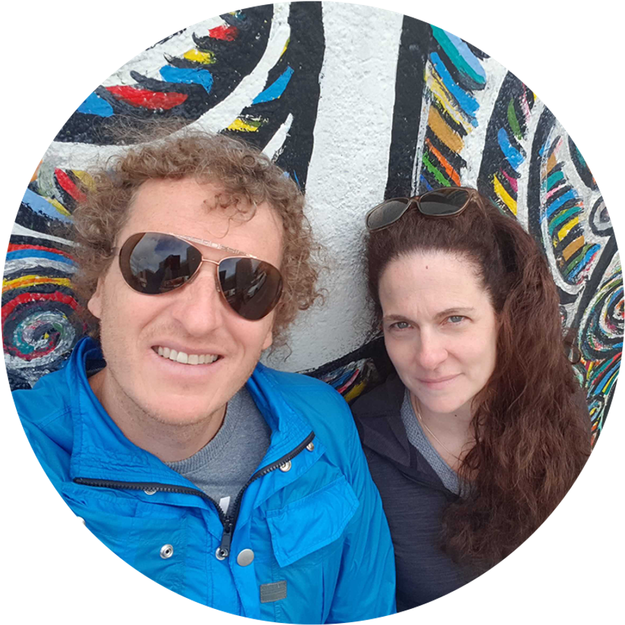 Efrat and her husband take a selfie by the Berlin Wall, illustrating Efrat’s proposal story and a meaningful, personal proposal moment.