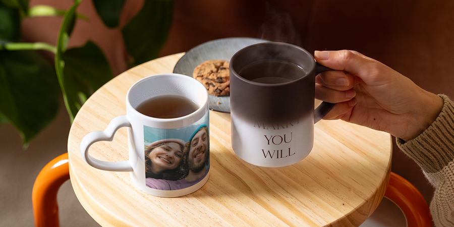 A personalised Photobox heat-changing mug slowly reveals the words “Will you marry me”, showing a creative and romantic proposal idea.